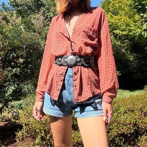 Sheer rust colored blouse